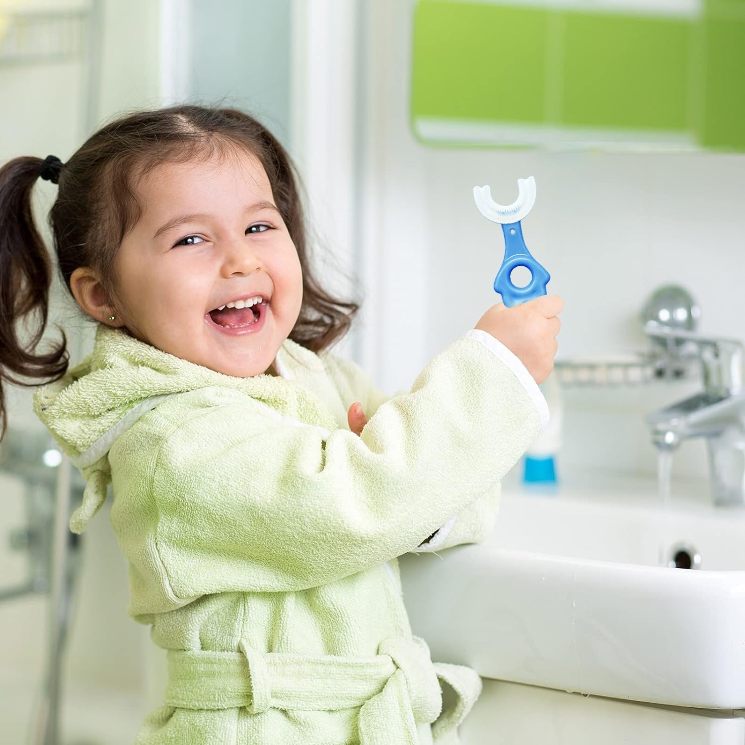 A girl holding blue color U-Shaped Kids Toothbrush