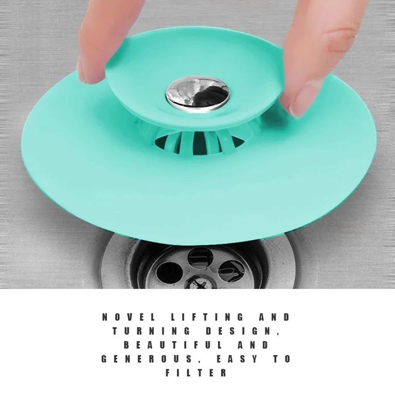 Someone is holding a Silicone Sink Hair Strainer for a basin