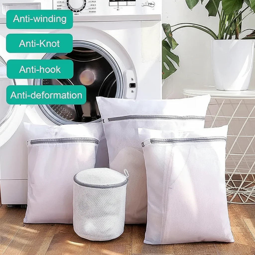 4 Pcs  Mesh Laundry Washing Bags Set in front of a washing machine.