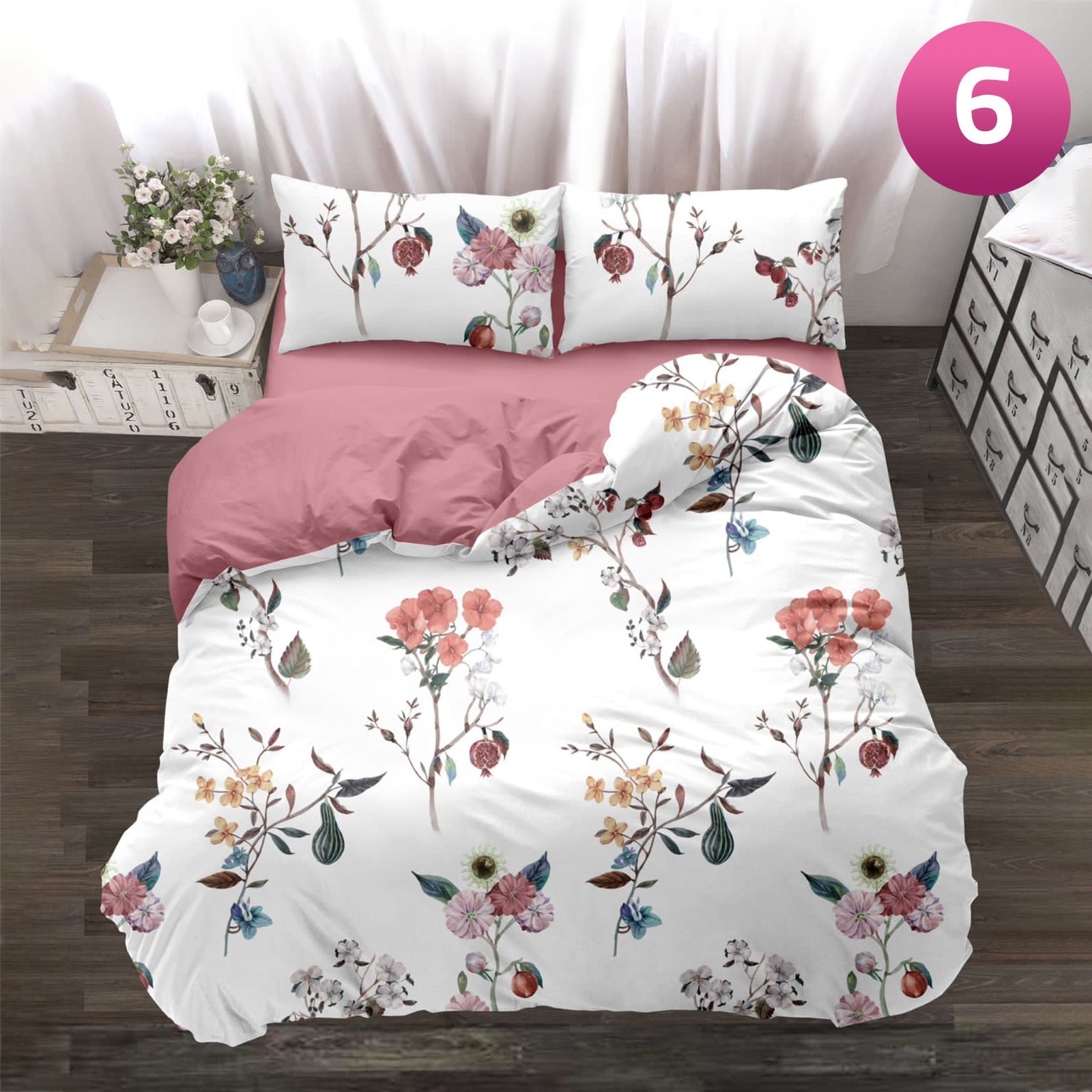 6-piece bedding set with floral comforter, fitted sheet, and pillow covers on a king bed.
