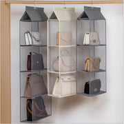 A Group Of Multi Layer Hanging Handbag Wardrobe Organizer On A Rack