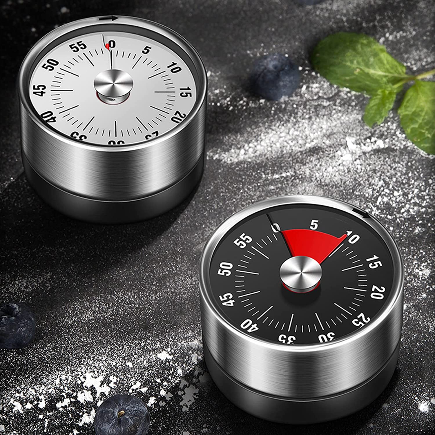 Two magnetic mechanical 60-minute timer on a table 