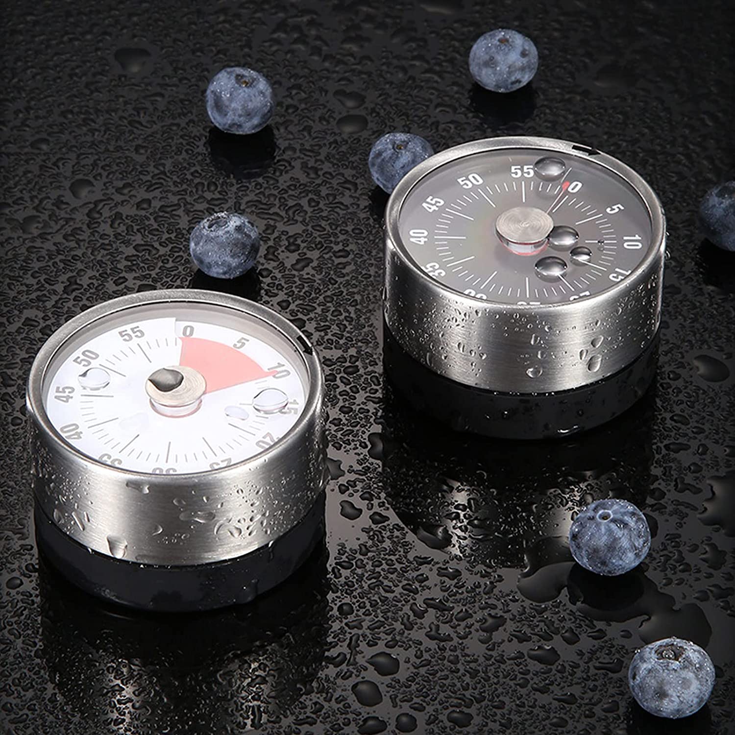 Two magnetic mechanical 60-minute timer on a table