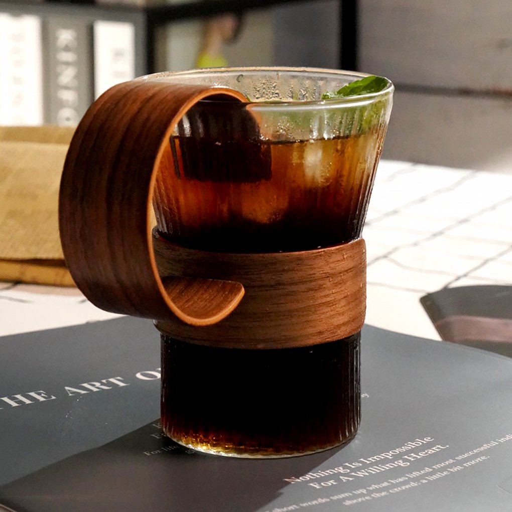 Wide Mouth Glass Coffee Mug with liquid, ice, and mint leaves