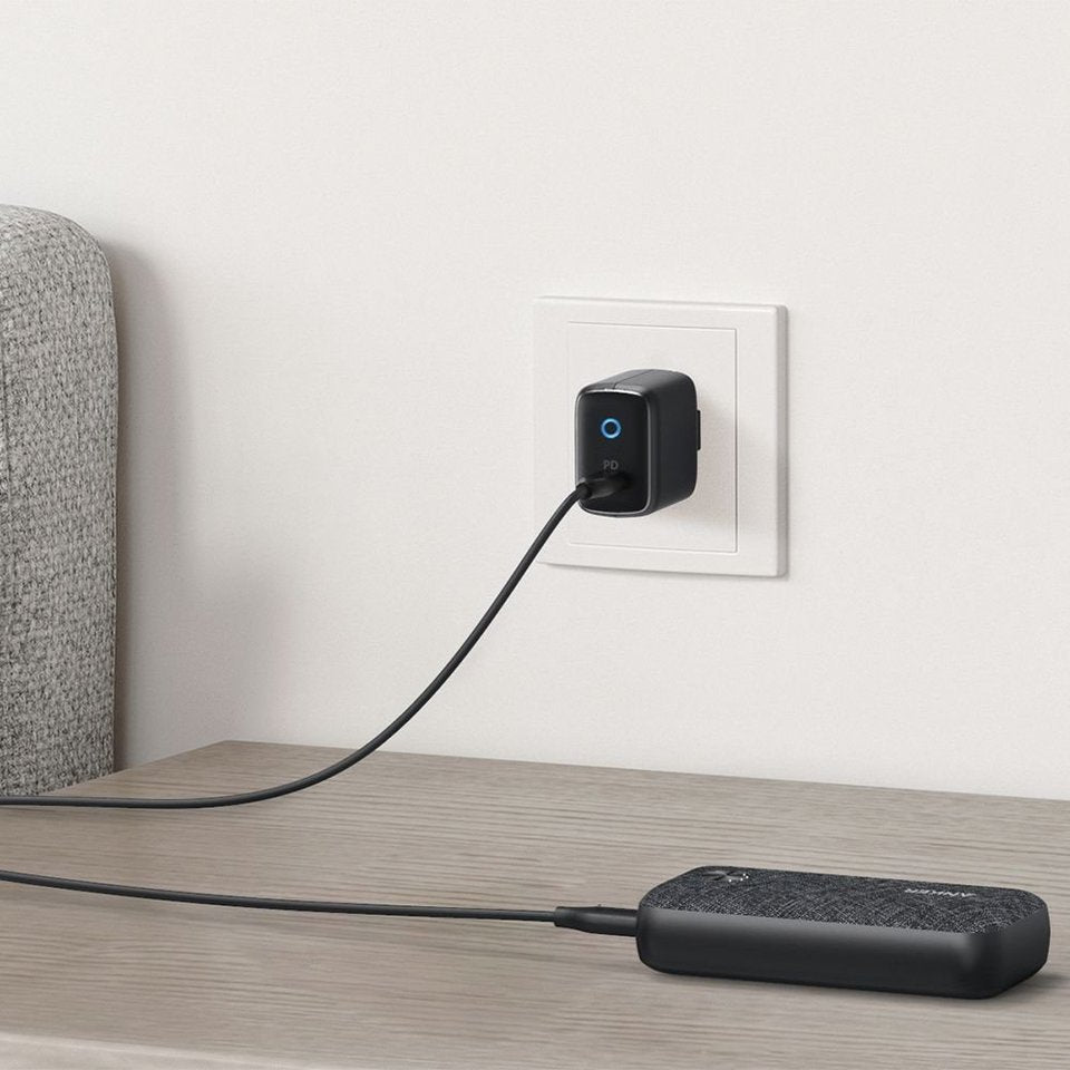 Anker PowerCore Metro 10000mAh Fast Charging Power Bank placed on the table and actively charging