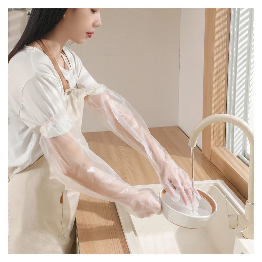 A Women is Cleaning Dishes By Wearing Disposable Anti- Slip Wear Long Sleeve Glove.