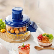 Automatic Electric Fruit & Vegetable Peeler with fruits and a dessert on a white surface