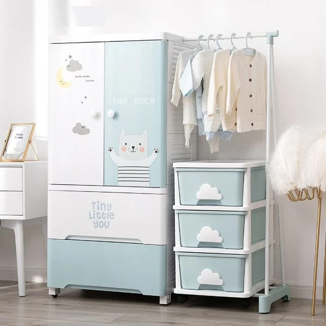 Baby Multi-Layer Drawer Type Wardrobe Shelf With Hanging Rack  Having Cloth On it.