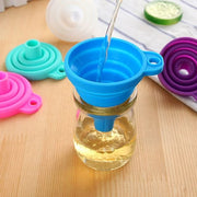  pouring oil into a bottle using a Silicone Telescopic Collapsible Mini Funnel