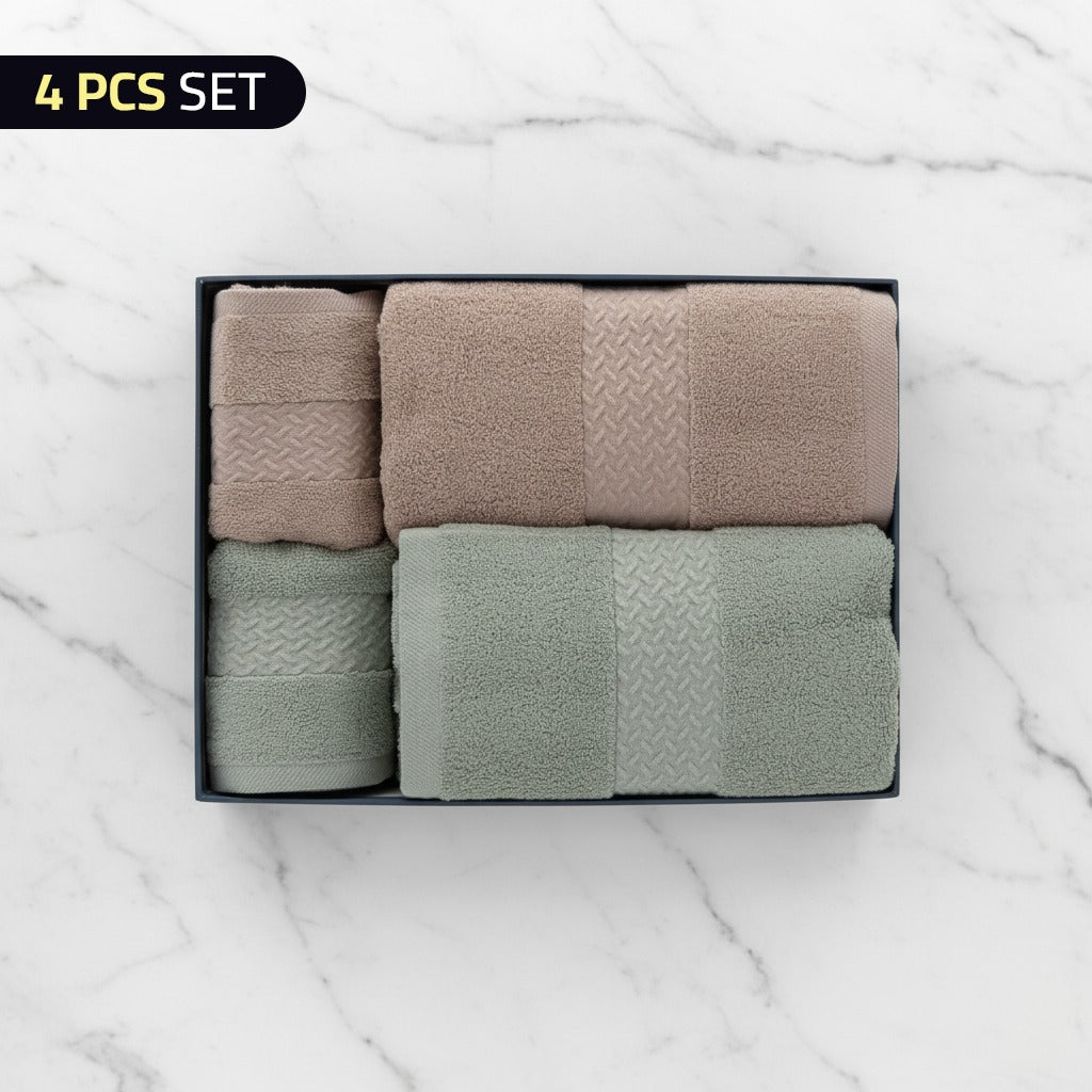 Set of four Cotton Bath & Face Towel Set in a box on a marble background