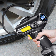 A Person is Inflating Tire Using  Digital Air Compressor Pump.