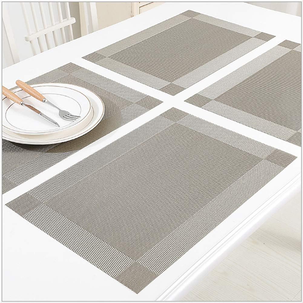 Dining Table Placemats on a white table with cutlery and plates.