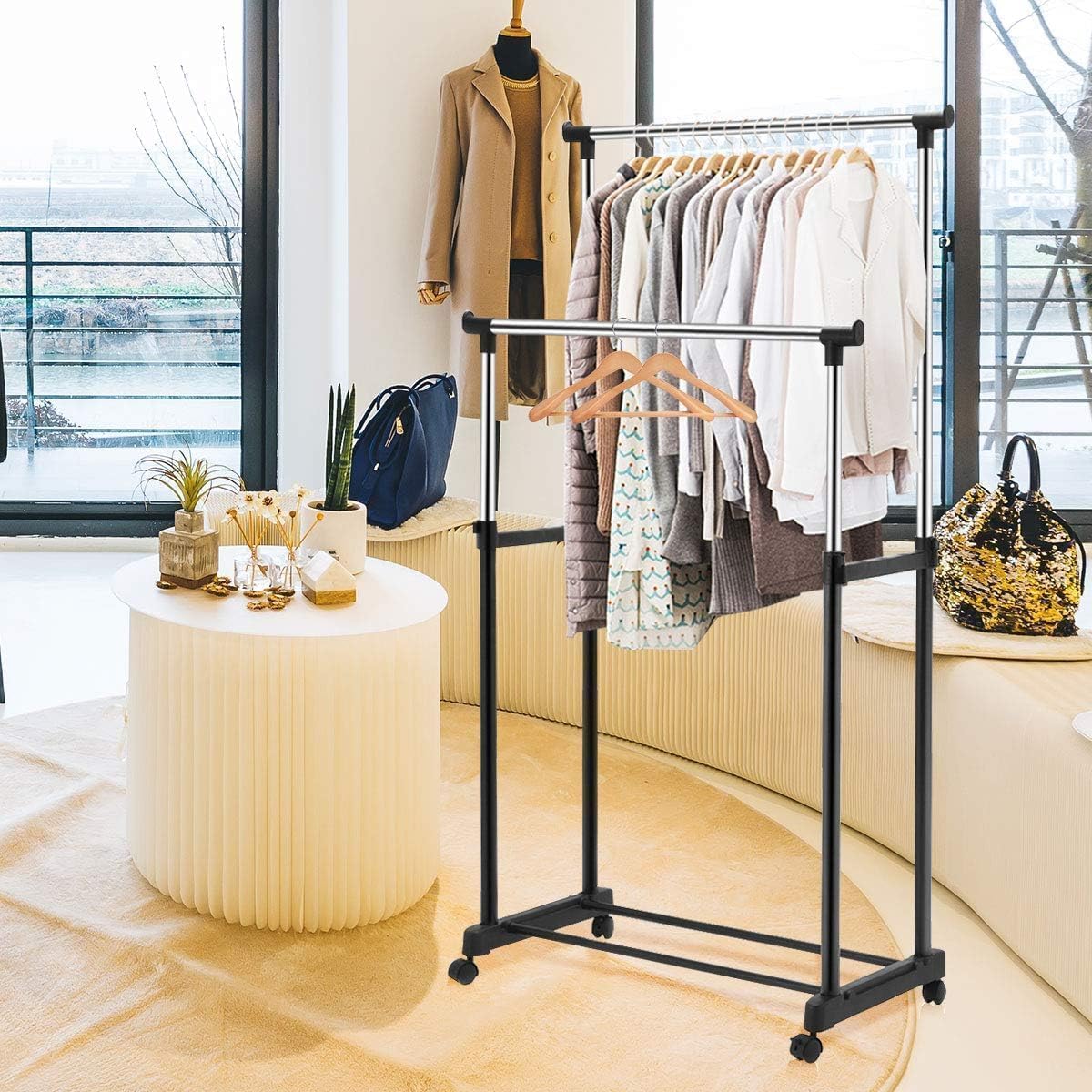 A Double Pole Portable Garment Rack Organized with Clothes.