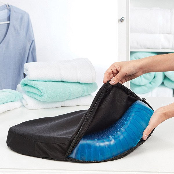 Someone taking an Egg Sitter Gel Chair Cushion from the bag