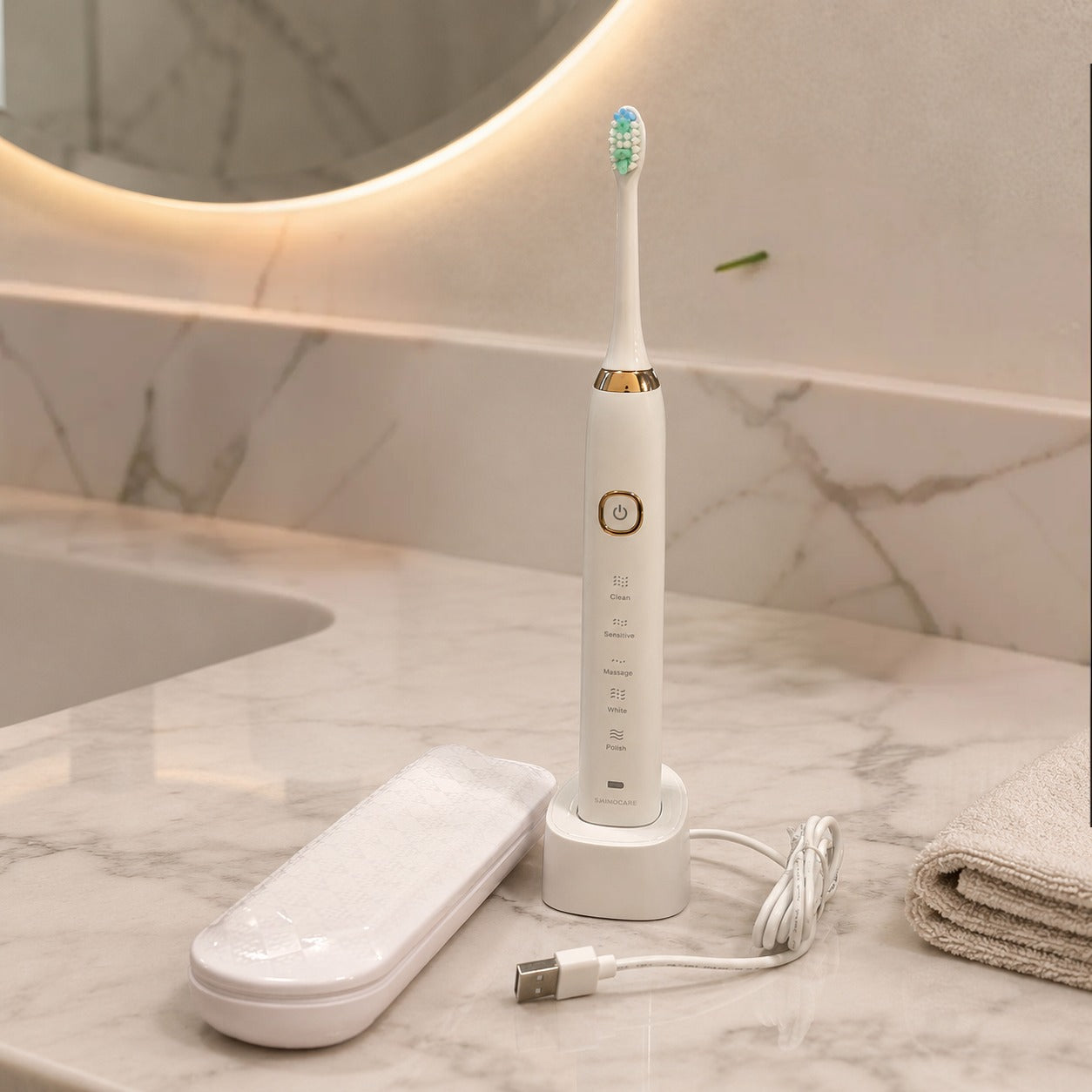 White electric toothbrush with charging stand on a bathroom counter