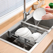 Expandable dish drying and washing basket placed next to the sink