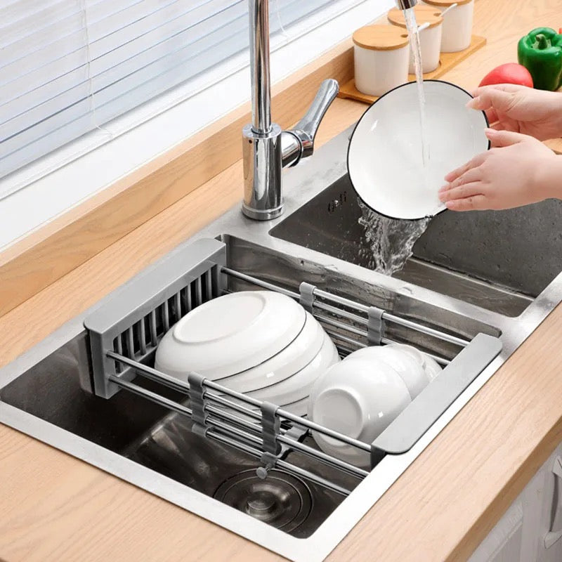 Expandable dish drying and washing basket placed next to the sink