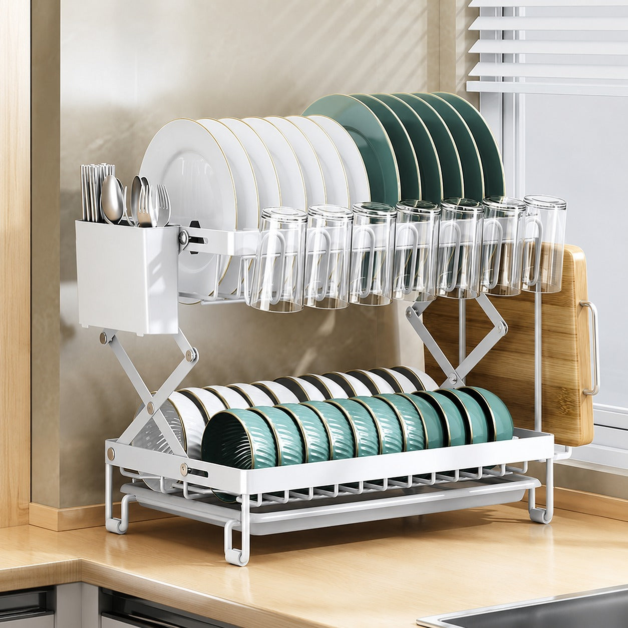 A dish drying rack holding plates, glasses, and cutlery, placed on a modern kitchen countertop.