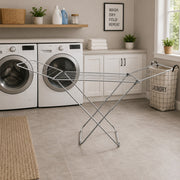 Laundry room with washing machines, dryer, and a Heavy Duty Foldable Clothes Drying Rack
