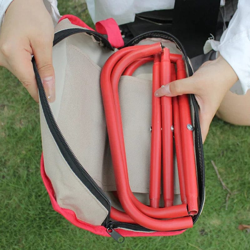 A Person is Folding Small Stool.