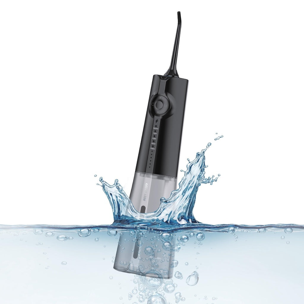 Green Lion Portable Oral Irrigator is Dipped in Water.