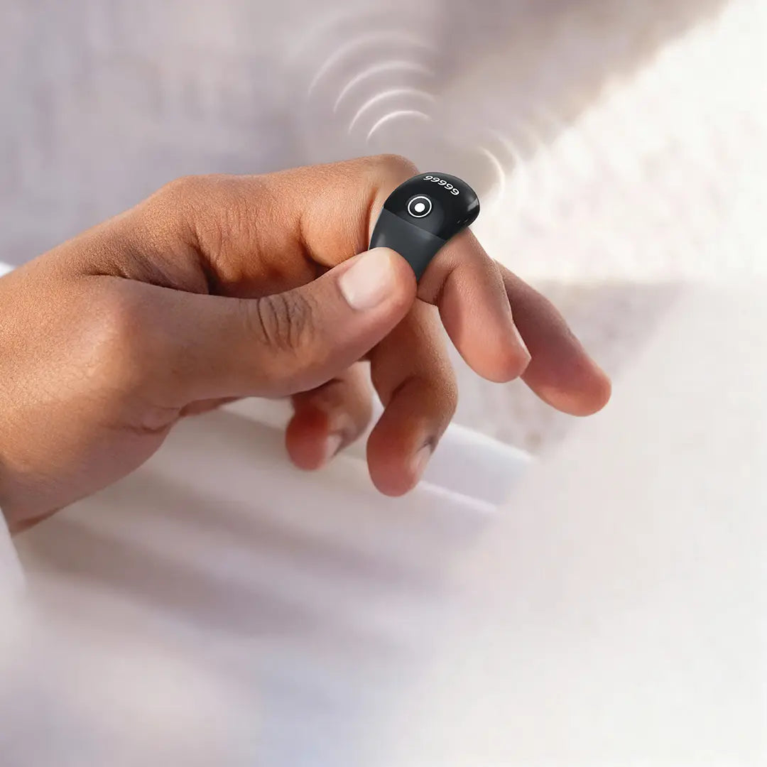 A person wearing a smart zikr ring on their finger, designed for counting and tracking with a simple button interface.