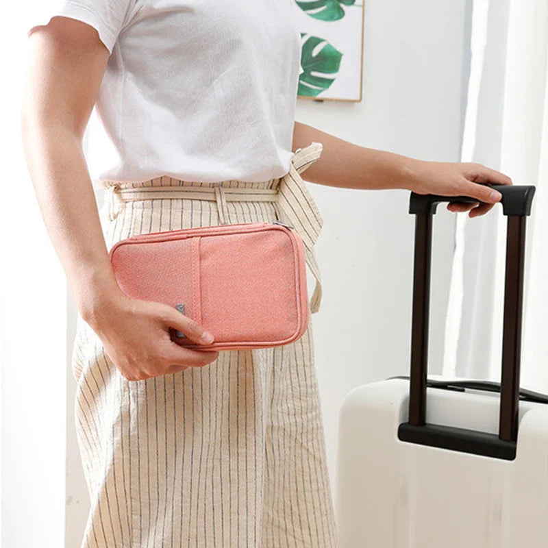 Someone confidently holding the Travel Passport and Document Organizer Bag with one hand