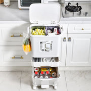 The kitchen features a garbage trash cans