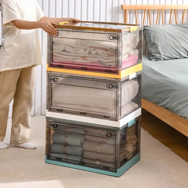 A person standing next to a foldable plastic storage boxes