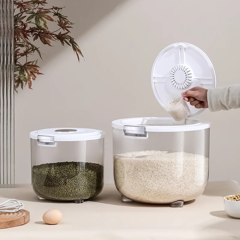 Someone putting rice into the Transparent Moisture-Proof Sealed Tank Storage Bucket for Rice