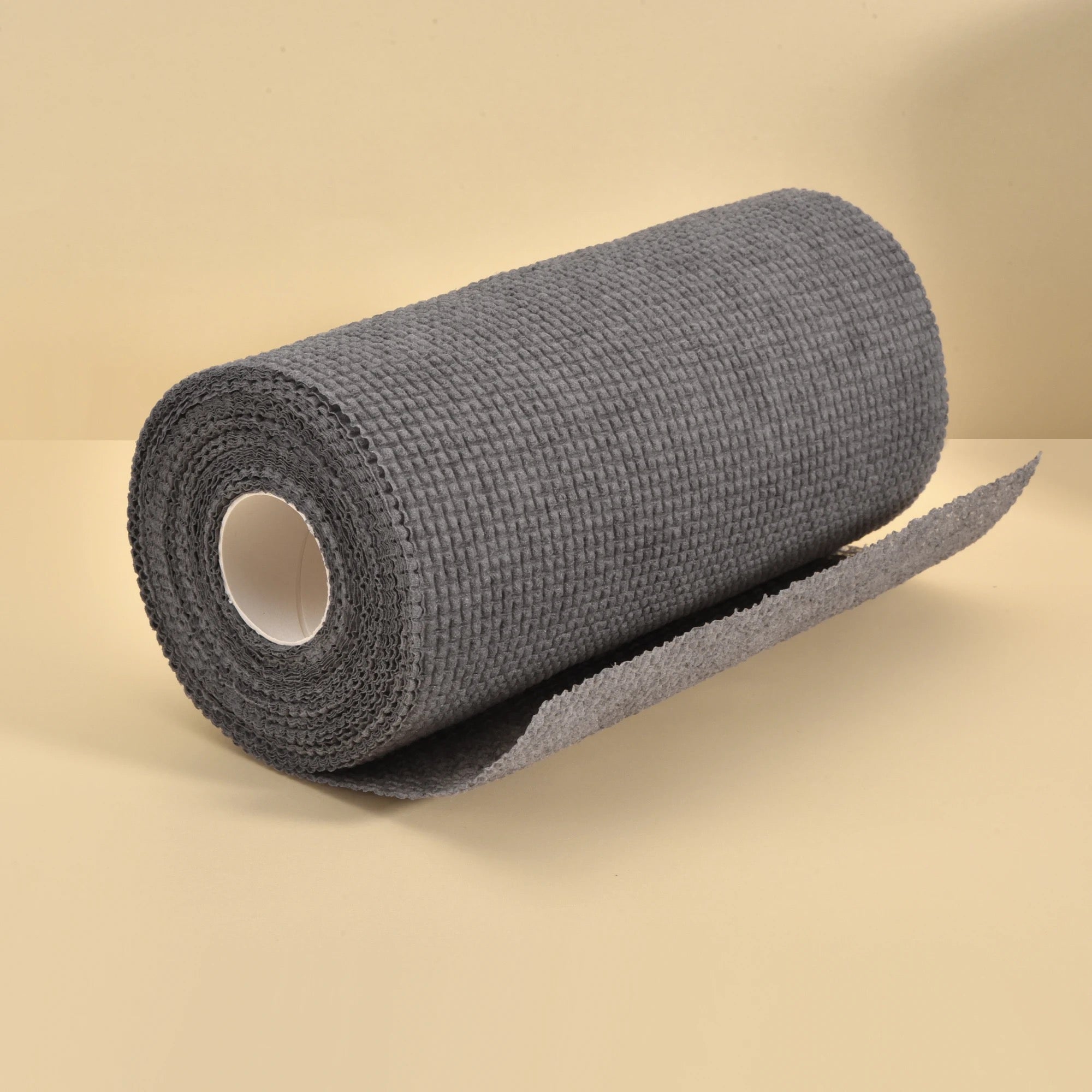 1 Roll/25pcs Disposable Kitchen Cleaning Cloth Roll placed unwrapped on a surface 
