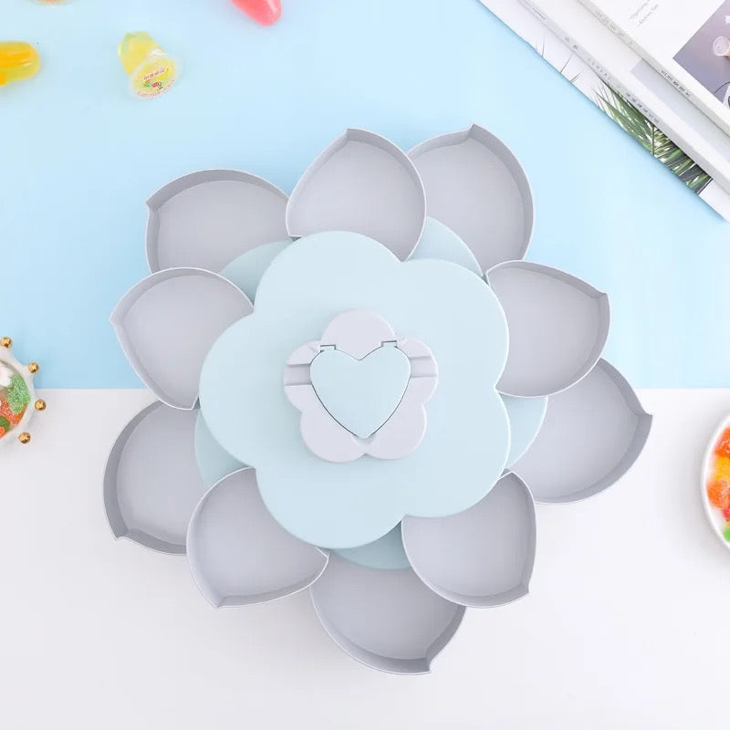 Blue Flower Design Snack Box kept opened and empty on a blue-white surface 