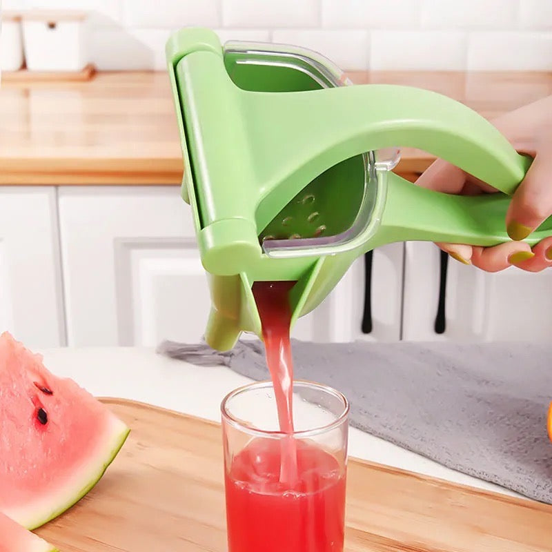 Someone making water lemon juice with the help of a manual juicer, handheld, non-electric lemon squeezer