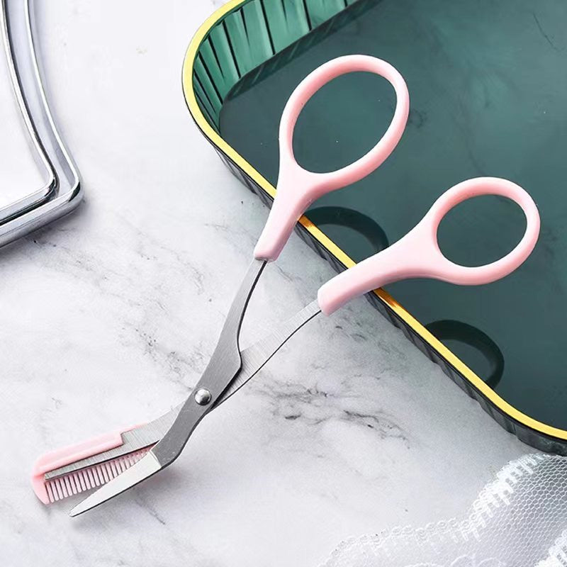 Eye Brow Trimmer Eyebrow Comb Scissors Makeup Tool Hair Removal placed next to some items