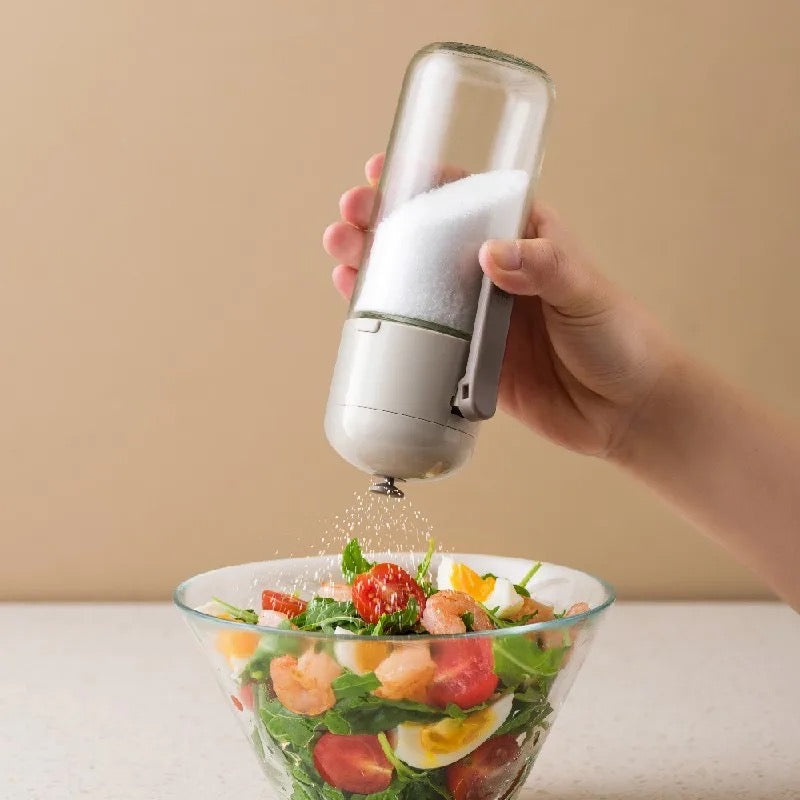 Someone putting salt from a 220ml Controlled Moisture-Proof Seasoning Bottle into food
