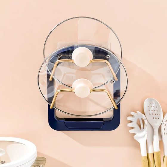 The Useful Kitchen 2 Tier Pot Lid Pan Holder Shelf is placed on the wall