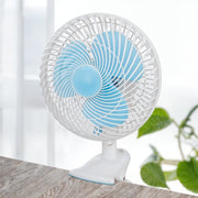 JIHAM 8-Inch Table & Clip Fan is Clipped on a Table.