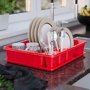 Plates and Bowls are Organized in a Kitchen Sink Dish Organizer Drying Rack.