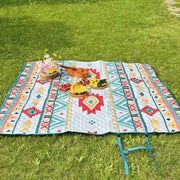Large Waterproof Foldable Picnic Mat on grass with food items