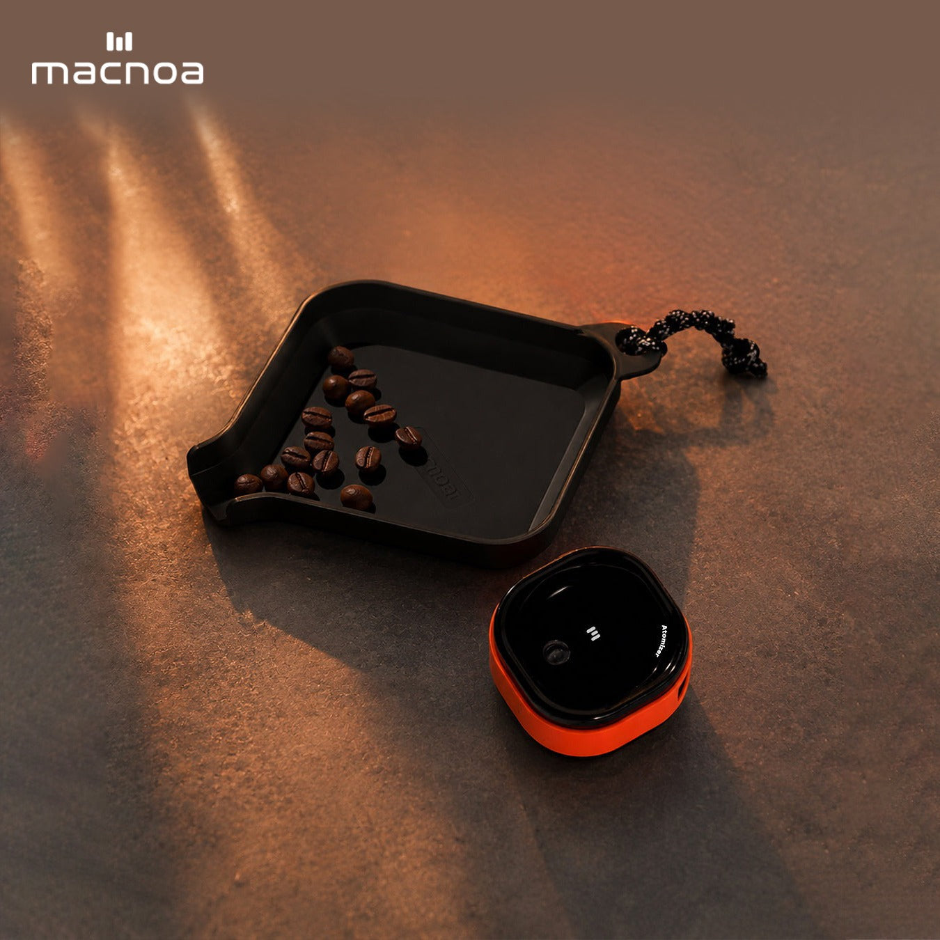 Macnoa MacX MistFlow Electric Coffee Atomizer with Coffee Beans on a Textured Surface