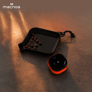 Macnoa MacX MistFlow Electric Coffee Atomizer with Coffee Beans on a Textured Surface