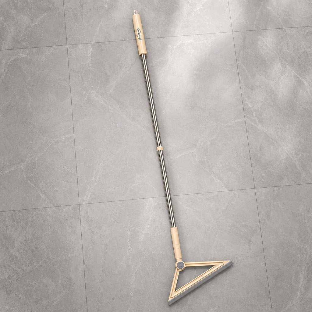 Magic Broom Floor Squeegee with a long handle and triangular head on a gray tiled floor