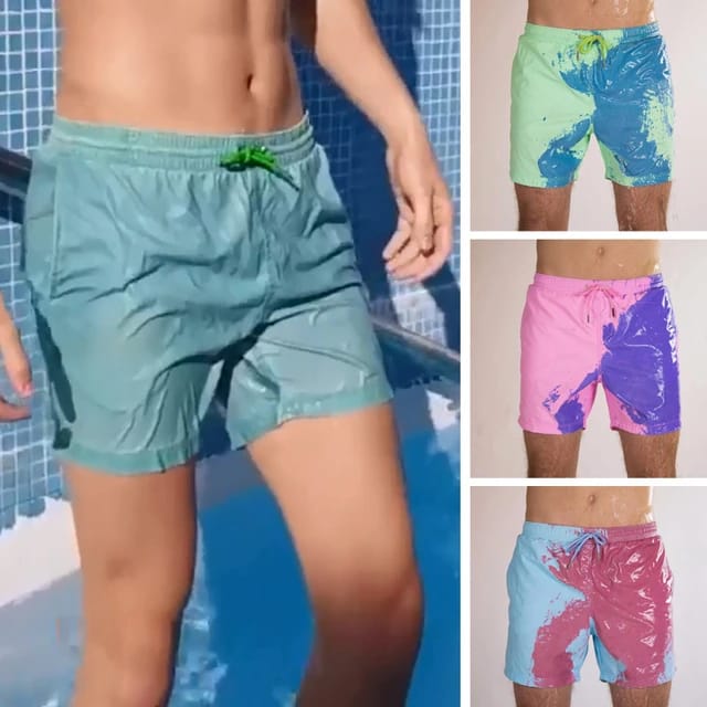 A Person is Wearing Men Color Changing  Beach Shorts.