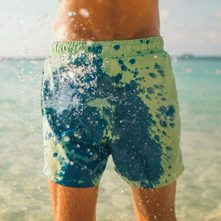 A Person is Wearing Men Color Changing  Beach Shorts.