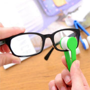 Someone cleaning glass with a Microfiber Eyeglass Cleaning Tool
