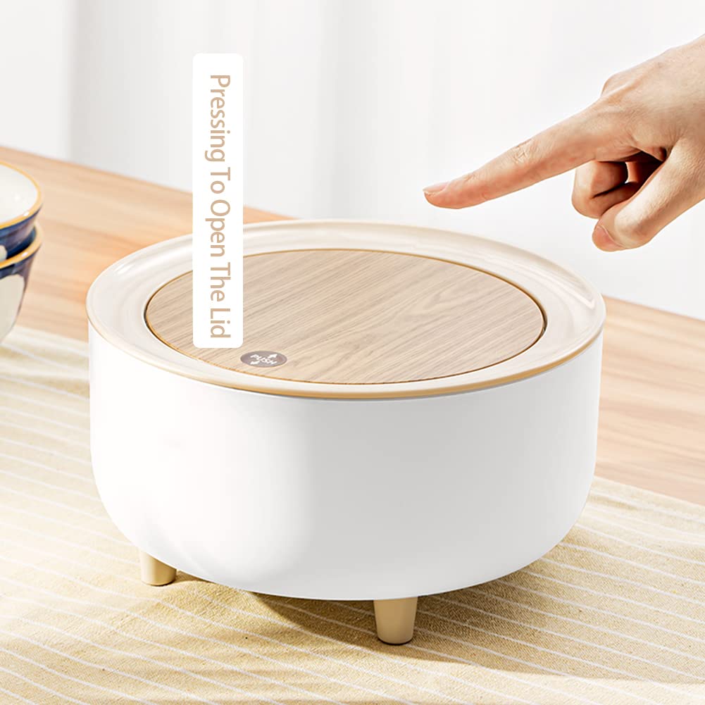 A Person is going to press the lid of Mini Trash Can