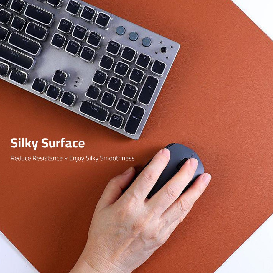A Person Is Using Keyboard and Mouse Placed On Large Laptop Desk Mouse Mat 