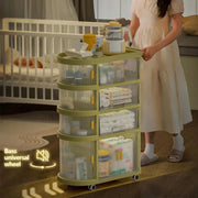 A girl rolling on the floor assembling the Free Installation Multi-Layer Folding Trolley Storage Rack