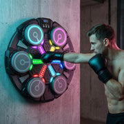 A man wearing boxing gloves punches a wall-mounted Music Boxing Machine with LED colorful light targets, designed for reflex and fitness training."