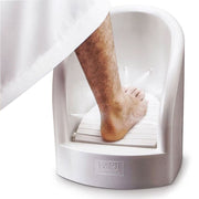 Someone performing ablution with the assistance of an Automatic Wudu Foot Washer